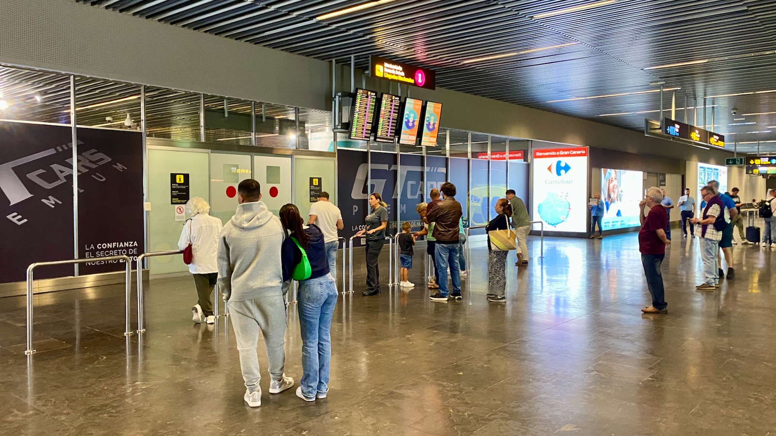 Arrivals hall at Gran Canaria Airport with passengers collecting luggage